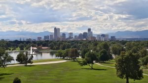 beautiful city landscape surrounded by clouds and trees