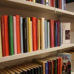 books lined up on bookshelf